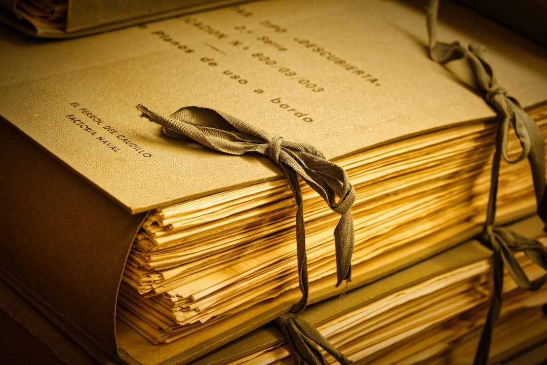Bundles of aged paper records tied with ribbon, representing the medical history against which a replacement insurance policy is underwritten